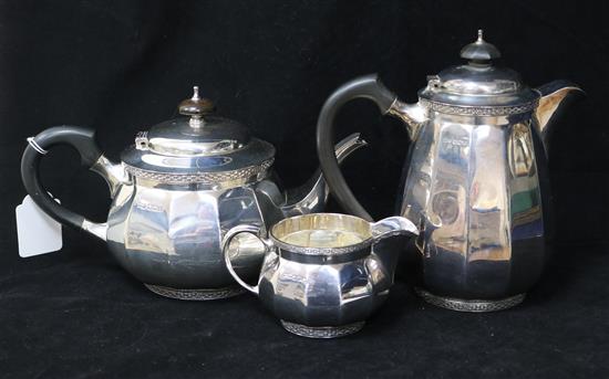 A late 1920s silver part three piece tea set by Walker & Hall, Sheffield, 1928, gross 49 oz.